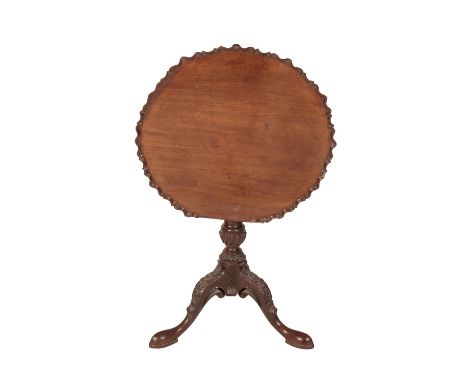 GEORGE II MAHOGANY TRIPOD TABLE, the circular tip-up top with a moulded pie-crust edge, on a gadrooned-carved baluster shaft 