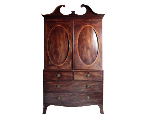 GEORGE III MAHOGANY AND SATINWOOD BANDED GENTLEMAN'S PRESS CUPBOARD of Hepplewhite design, with a dentilled swan-neck pedimen
