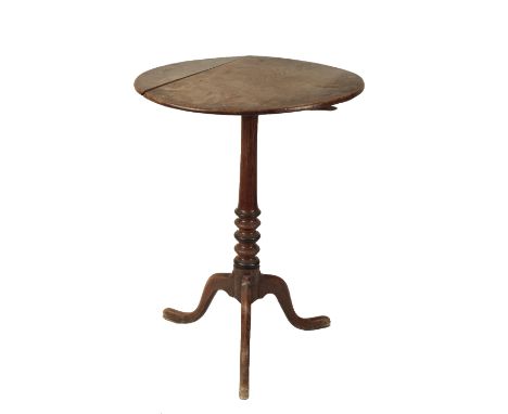 A GEORGE III OAK TRIPOD TABLE with a circular tip-up top, on a partly ebonised baluster turned shaft and a faceted tripod bas