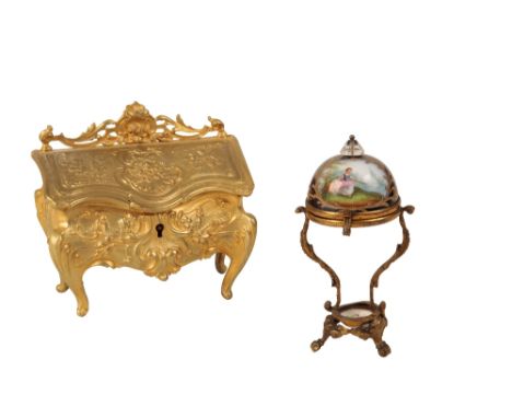 A MINIATURE DOLLS HOUSE GILT METAL BOMBE BUREAU  of 18th century design, in a jewel casket velvet lined interior, 12cm, and a