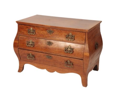 DUTCH MAHOGANY BOMBE COMMODE circa 1800 with gilt metal mounts the rectangulat top above three long draws raised on splade br