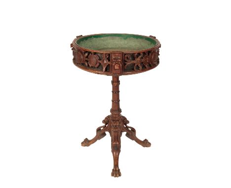 WILLIAM IV OAK JARDINIERE STAND in the historical revival style, the revolving circular top with a frieze carved and pierced 