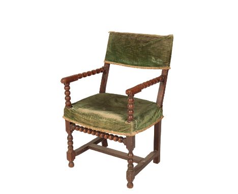WILLIAM AND MARY OAK ARMCHAIR with bobbin-turned arms and a conforming underframe joined by a rectangular "H"-stretcher, 56cm