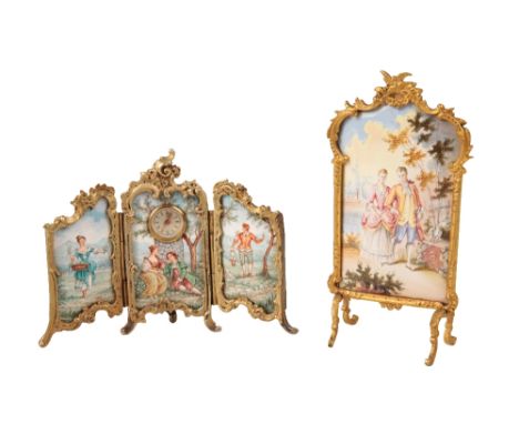 A VIENNESE ENAMEL GILT METAL TRIPTYCH CLOCK AND SCREEN  with hinged folding outer panels, decorated with figures in an arcadi