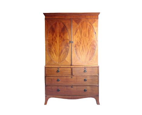 GEORGE III MAHOGANY LINEN PRESS of Hepplewhite design, the upper section with a moulded cornice over a pair of oval panelled 