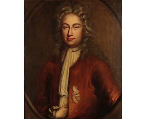 MANNER OF SIR GODFREY KNELLER (1646-1723) Half-length portrait of a gentleman wearing a white wig and a red jacket, feigned o