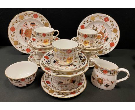 A Royal Crown Derby Asian Rose 8687 pattern part tea service for six comprising teacups &amp; saucers; side plates, sugar bow