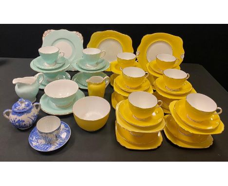 A Tuscan China Art Deco part tea service comprising of teacups &amp; saucers, side plates, sugar bowl &amp; milk jug; another