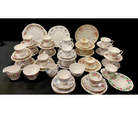 A Colclough part tea service decorated with roses and foliage comprising teacups &amp; saucers, side plates, sandwich plate, 