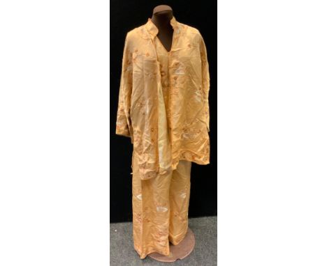 A hand embroidered silk three piece ladies suit, comprising, sleeveless blouse , pair of trousers and jacket, all intricately