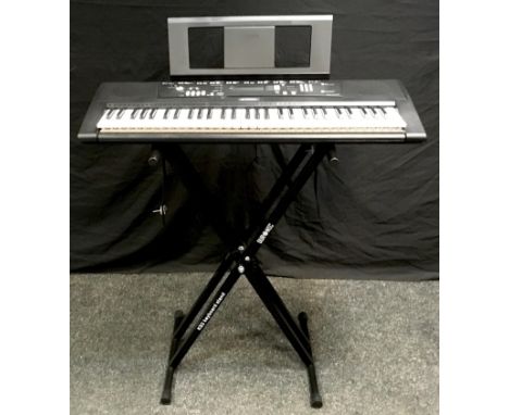 A Yamaha EZ-220 electric keyboard with Duronic KS2 keyboard stand and owners manual. 