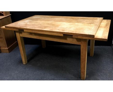 A contemporary light oak extending dining table. 81cm high x 91.5cm wide x 153cm long extending to 237cm 