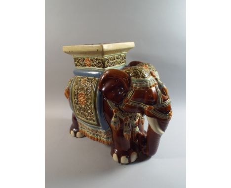 A Large Ceramic Seat in The Form of An Elephant, Decorated in Multi Colour Enamels, 43 cm High