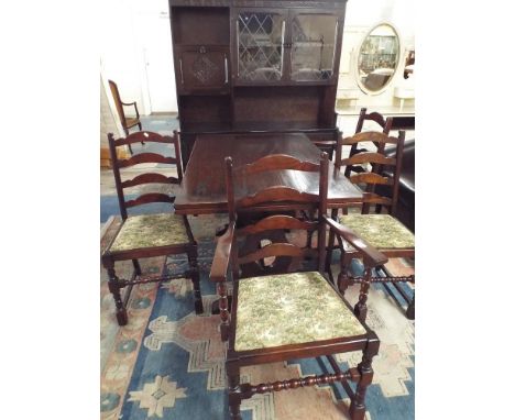 An Oak Dining Room Suite Comprising Draw Leaf Table, Sideboard Unit and Four Ladder Back Chairs  