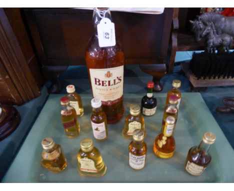 A Litre Bottle of Bell's Scotch Whisky together with Twelve Bottles of Miniature Whisky, Brandy Etc