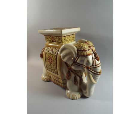 A Large Ceramic Seat in The Form of An Elephant, Decorated in Multi Colour Enamels, 43 cm High