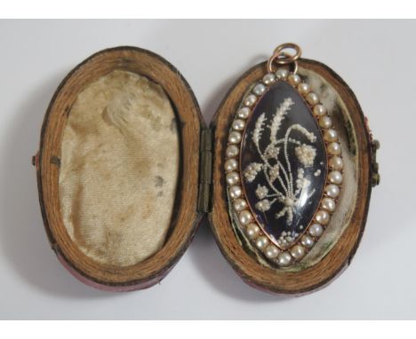 A Pretty Cased Georgian Gold, Pearl and Seed Pearl  Memorial Pendant / Brooch decorated with a foliate spray, 39.5x22mm, 7.5g