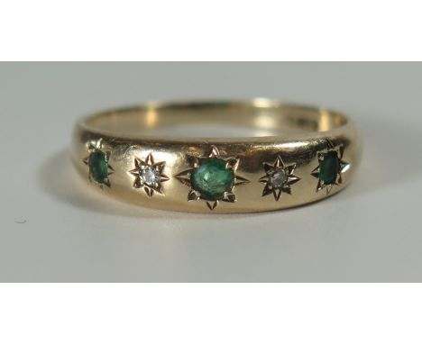 A 9ct Gold, Emerald and Diamond Gypsy Ring, size O.5, 2.3g 