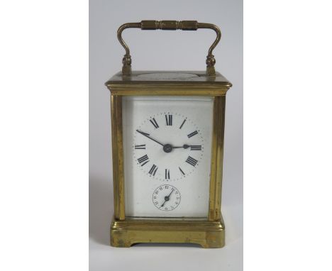 A Gilt Brass Carriage Clock, 15cm. With key, not running, balance seems to be ok 