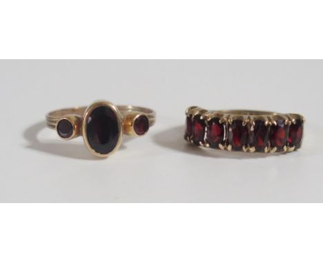 Two 9ct Gold and Garnet Rings, 7 stone size J.5, 2.8g and 3 stone M.5, 2.6g 