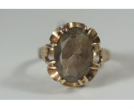 A 9ct Gold and Smokey Quartz Ring, 19x10mm stone, size R.5, 4.3g 