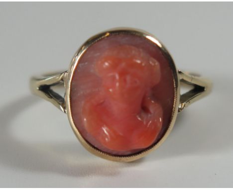 An Antique Unmarked Gold and Coral Cameo Ring decorated with a female bust, size O.75, 4g 