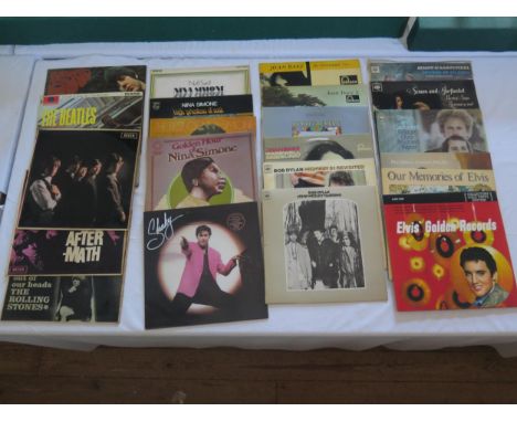 A Collection of LP Records Including The Rolling Stones, The Beatles, Nina Simone, Joan Baez, Bob Dylan, Simon and Garfunkel,