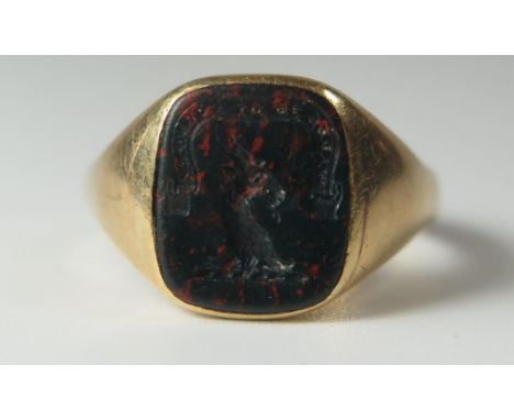 An 18ct Gold and Bloodstone Seal Ring engraved with a goats head and 'WALES IS MY COUNTRY', size Q.5, 8g 