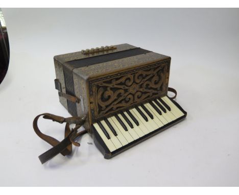 A Hohner Steel Reeds 12 Button Accordion 