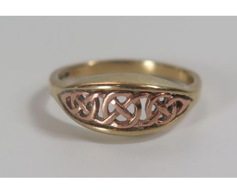 A Clogau 9ct Yellow and Rose Gold Ring, size O.5, 3g 