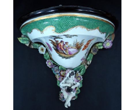 A 19th Century Porcelain Mounted Wall Bracket, top surface 33cm wide x 23cm deep 