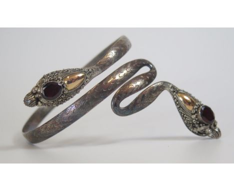 A Sterling Silver, Garnet and Yellow Metal Snake Bangle, 39g 