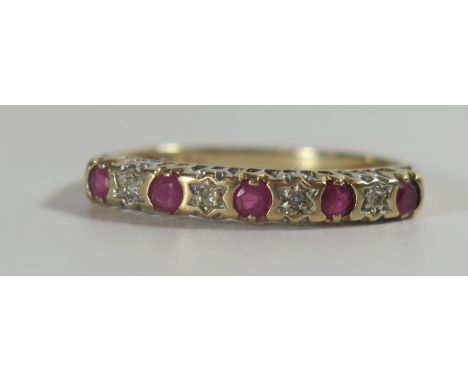 A Ruby and Diamond Nine Stone ring in an unmarked gold setting, size O, 1.4g 