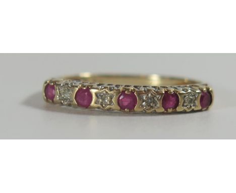 A Ruby and Diamond Nine Stone ring in an unmarked gold setting, size O, 1.4g 