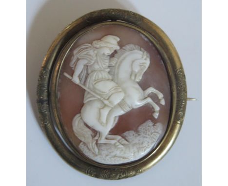 A Victorian Swivel Shell Cameo Brooch decorated with a soldier on rearing stallion and with a glazed panel verso and in a gil