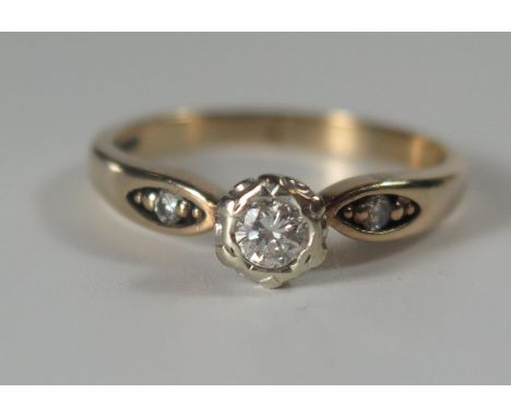 A 9ct Gold and Diamond Ring set with two small diamonds to the shoulders, rub over setting, .25ct, size R, 3.2g 