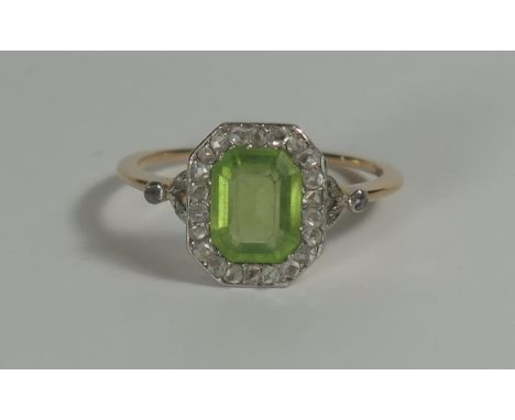 An Unmarked Gold and Platinum Light Green Stone and Rose Cut Diamond Ring, 8.3x6.5mm central stone, 12x10mm head, size P.5, 3