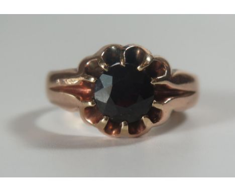 A Gent's 9ct Gold and Garnet Ring, Birmingham W, 8mm diam. garnet, size X, 6.8g 