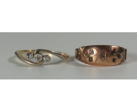 A 9ct Gold and Diamond Three Stone Crossover Ring (size N, 2g) and one other 9ct ring, A/F (size O, 1.5g) 