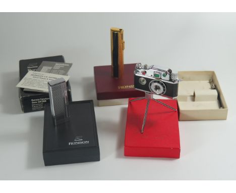 Two Boxed RONSON Lighters and Photo Flash Table Lighter. Both Ronson lighting, camera lighter appears unused. 