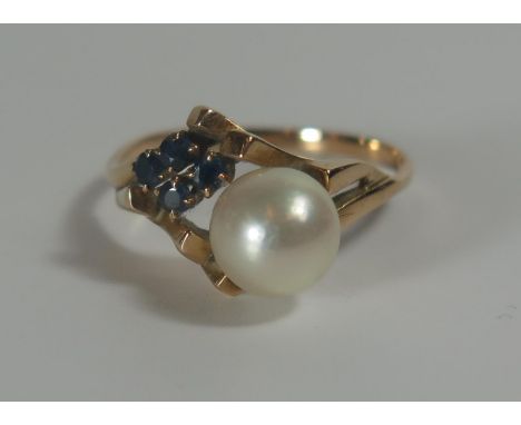 A Five Stone Pearl and Sapphire Ring in an unmarked gold setting, 6.5mm pearl, size N.5, 2.5g 