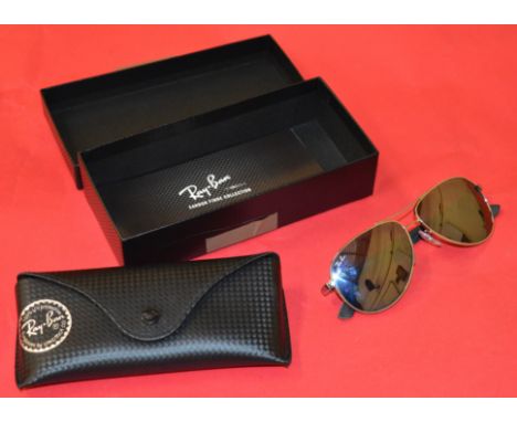 POLICE > A pair of Ray-Ban carbon fibre sunglasses with case  [NO RESERVE] [VAT ON HAMMER PRICE]   