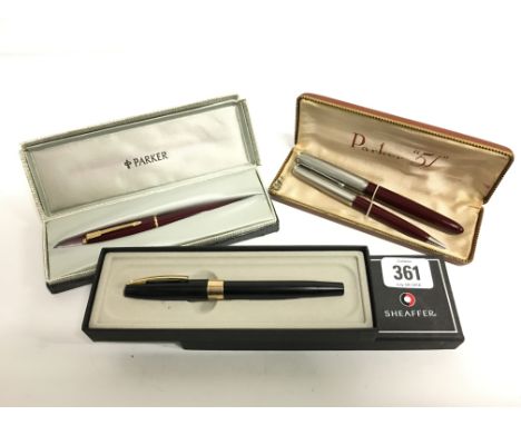 A Parker 51 fountain pen and pencil in case together with a Parker Lady 17 fountain pen in box and a Sheaffer black cased fou