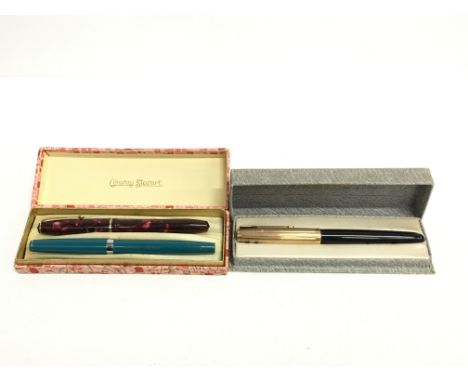 A Conway Stewart red marble cased fountain pen together with a Parker fountain pen and one other.