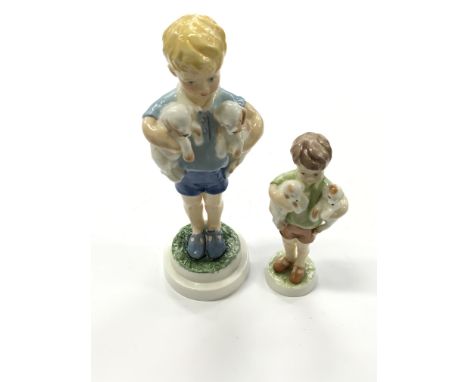 A Royal Worcester model of a Young Boy with Two Puppies by Freda Doughty: Three's Company together with a similar study "Mond