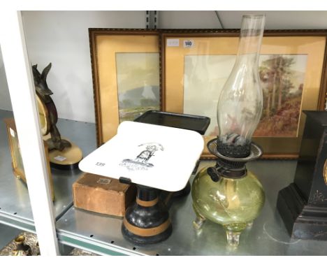 An early 20th century pair of Grocer's scales and weights with white china tray together with a glass oil lamp.