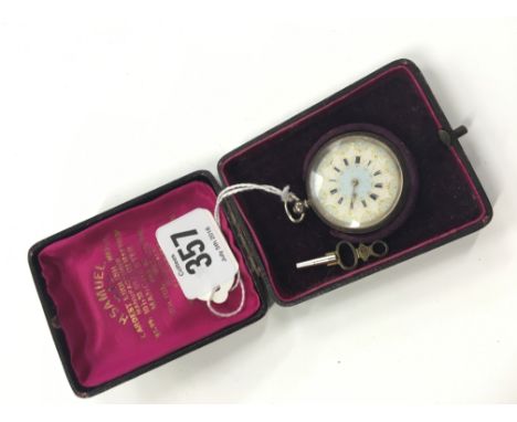 A ladies silver cased fob watch with engraved floral decoration, white enamel dial with gilt surround and Roman numerals in p