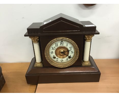 A late 19th century metal cased architectural mantle clock.
