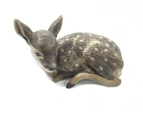 A Poole Pottery Barbara Linley Adams stoneware model of a Seated Deer.
