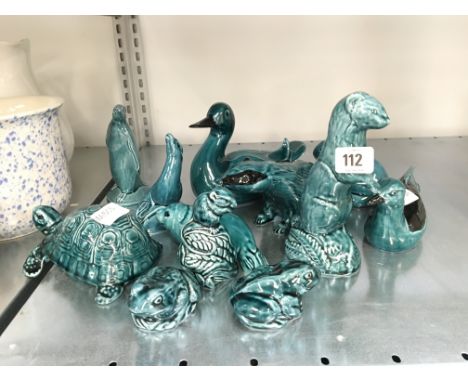 A collection of various blue glazed Poole Pottery animal ornaments.